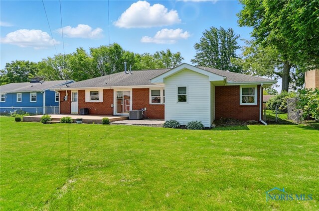 642 Edith Ave, Findlay, OH 45840 - rear view of property with brick siding and a patio