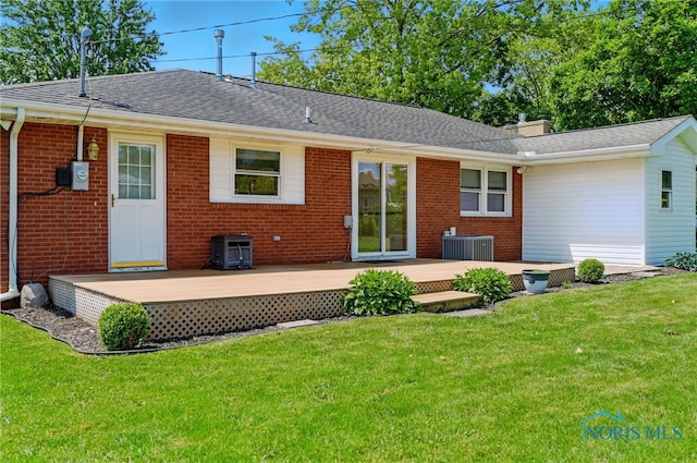 642 Edith Ave, Findlay, OH 45840 - back of house with brick siding, a wooden deck, a yard, and a shingled roof
