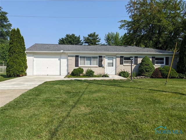 5022 Stengel Ave, Toledo, OH 43614 - ranch-style house featuring driveway, an attached garage, a front lawn, and brick siding