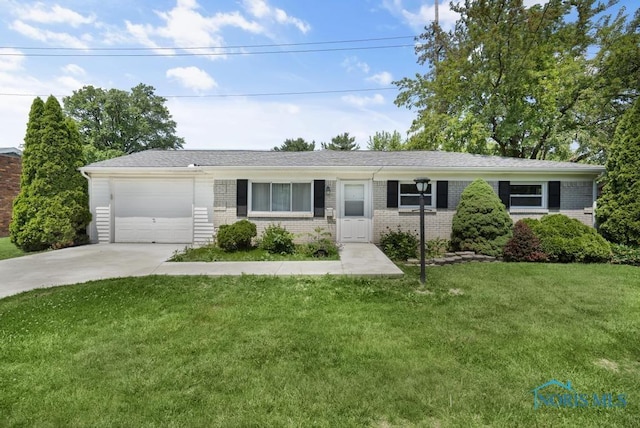 5022 Stengel Ave, Toledo, OH 43614 - ranch-style home featuring concrete driveway, brick siding, a front yard, and a garage