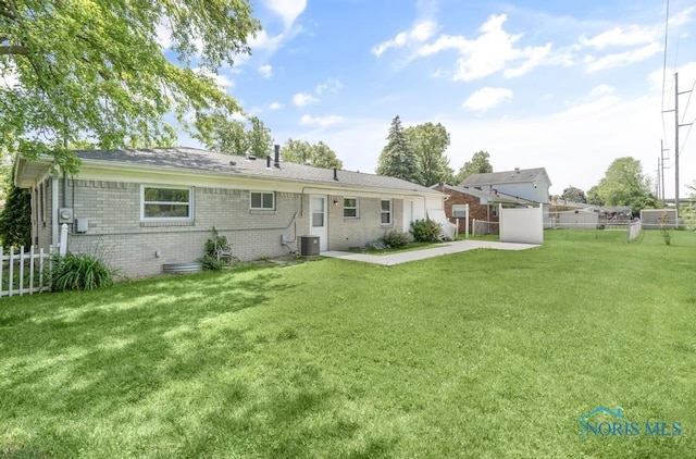 5022 Stengel Ave, Toledo, OH 43614 - back of property featuring brick siding and a patio area