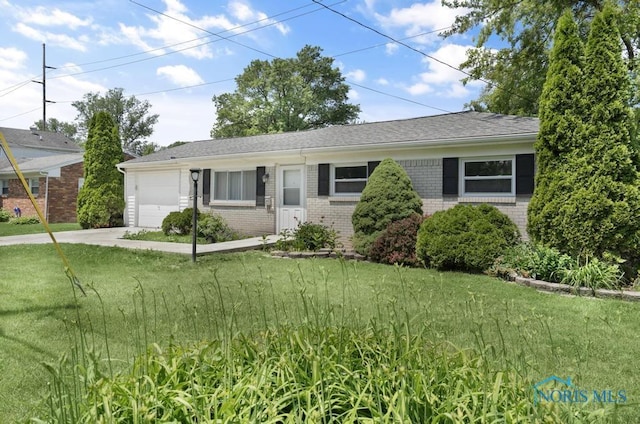 5022 Stengel Ave, Toledo, OH 43614 - single story home featuring brick siding, an attached garage, and a front lawn