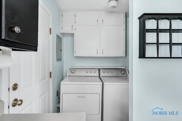 5022 Stengel Ave, Toledo, OH 43614 - laundry area featuring independent washer and dryer, cabinet space, and electric panel