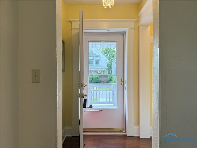 831 Butler St, Toledo, OH 43605 - doorway with a chandelier and wood finished floors