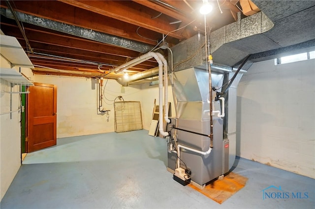 2816 Middlesex Dr, Toledo, OH 43606 - below grade area with heating unit and concrete block wall
