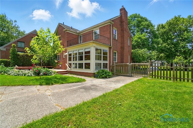 2816 Middlesex Dr, Toledo, OH 43606 - back of house featuring a chimney and brick siding