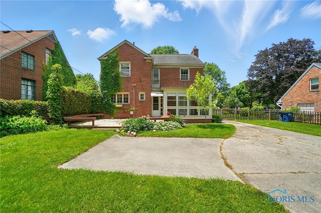 2816 Middlesex Dr, Toledo, OH 43606 - rear view of house featuring a chimney and brick siding