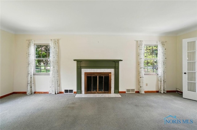 2816 Middlesex Dr, Toledo, OH 43606 - unfurnished living room featuring carpet floors and a fireplace