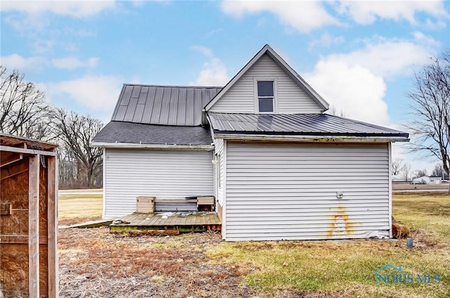 225 2nd St, Latty, OH 45855 - view of side of home with a deck and a metal roof