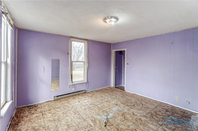 225 2nd St, Latty, OH 45855 - empty room featuring a baseboard radiator