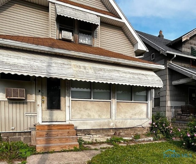 609 E Broadway St, Toledo, OH 43605 - view of front of property with entry steps and a wall mounted air conditioner