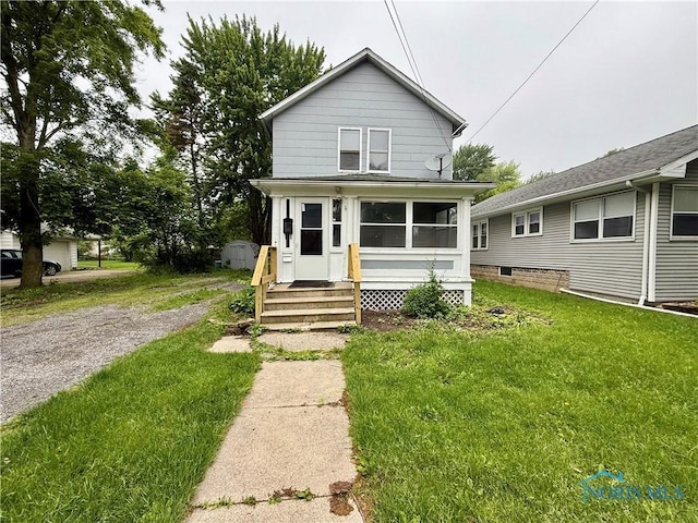 223 E Leggett St, Wauseon, OH 43567 - view of front of house with a front lawn and entry steps