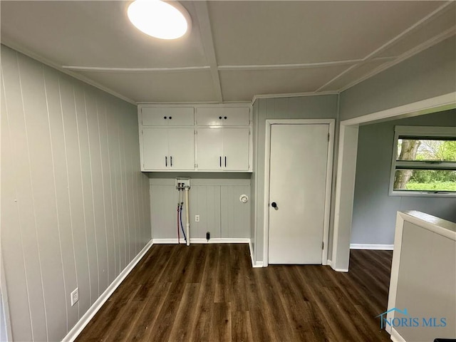 223 E Leggett St, Wauseon, OH 43567 - washroom featuring dark wood-type flooring and cabinet space