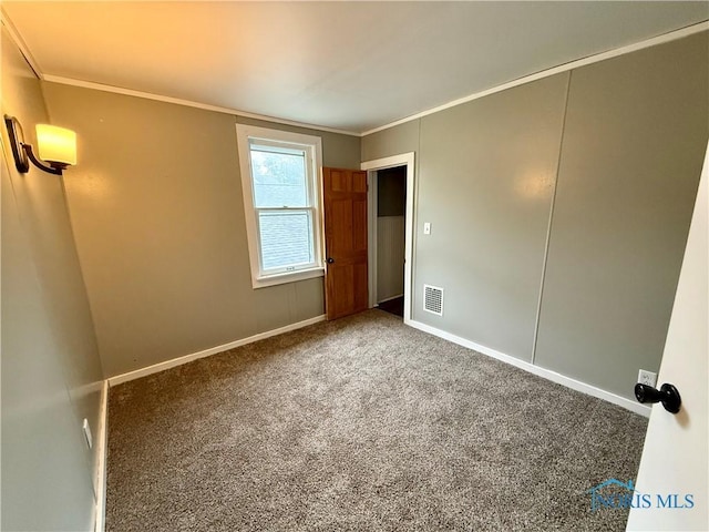 223 E Leggett St, Wauseon, OH 43567 - carpeted spare room featuring crown molding