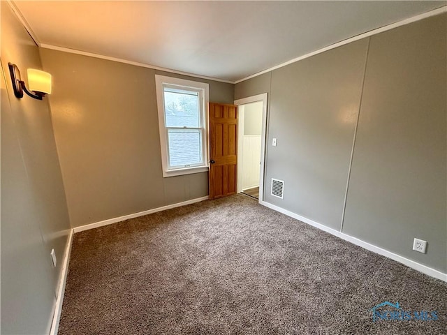 223 E Leggett St, Wauseon, OH 43567 - carpeted spare room with crown molding and baseboards
