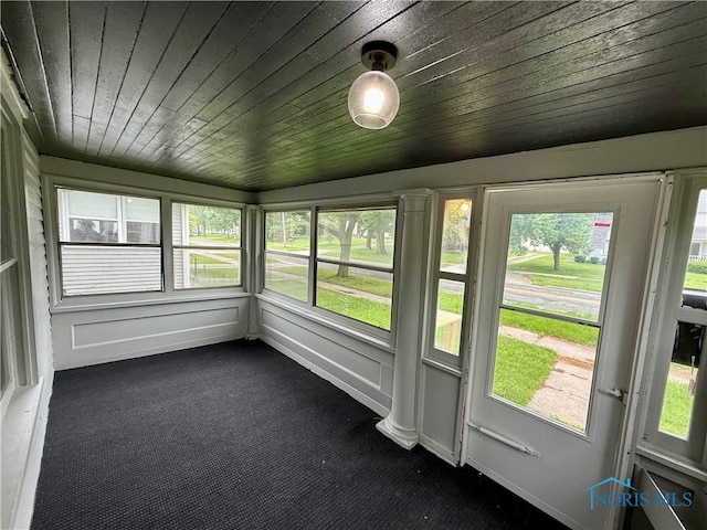 223 E Leggett St, Wauseon, OH 43567 - unfurnished sunroom featuring carpet, plenty of natural light, and wooden ceiling