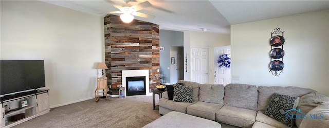 149 Carlee Ln, Findlay, OH 45840 - living area featuring a ceiling fan, vaulted ceiling, a stone fireplace, and carpet floors