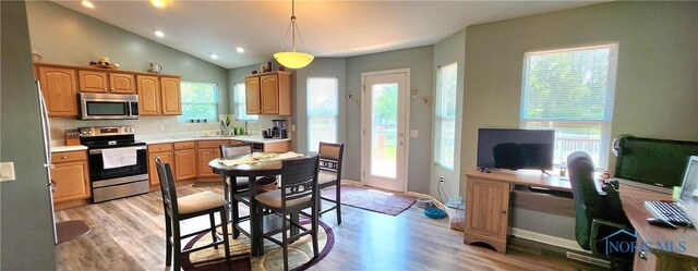 149 Carlee Ln, Findlay, OH 45840 - kitchen featuring stainless steel appliances, light wood-type flooring, light countertops, recessed lighting, and a desk