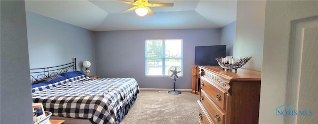 149 Carlee Ln, Findlay, OH 45840 - bedroom featuring light carpet, a raised ceiling, and a ceiling fan