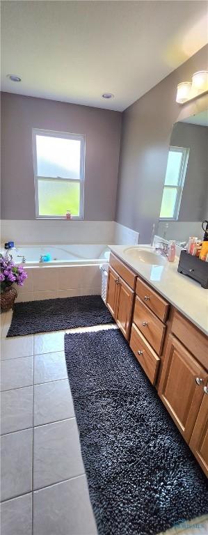 149 Carlee Ln, Findlay, OH 45840 - bathroom featuring vanity, a bath, and tile patterned floors