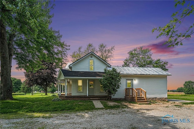 11820 County Road 17, West Unity, OH 43570 - view of front of house with a lawn and covered porch