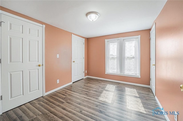 11820 County Road 17, West Unity, OH 43570 - unfurnished bedroom featuring wood finished floors and baseboards