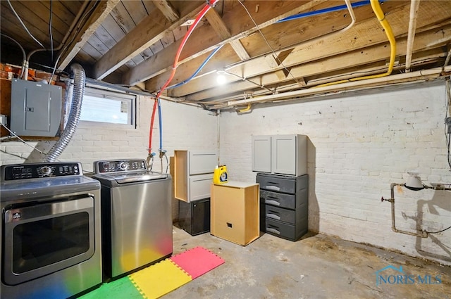 2727 Robinwood Ave, Toledo, OH 43610 - basement with electric panel, washing machine and clothes dryer, and brick wall