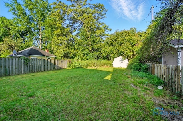 2727 Robinwood Ave, Toledo, OH 43610 - fenced backyard with a shed