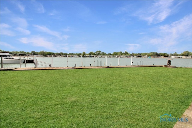 1660 N Compass Ave, Port Clinton, OH 43452 - view of yard with a dock and a water view