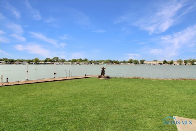 1660 N Compass Ave, Port Clinton, OH 43452 - view of grassy yard featuring a boat dock and a water view