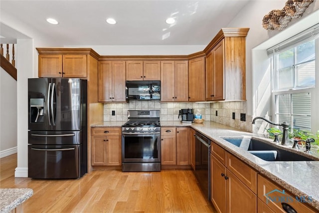 440 W 3rd St, Perrysburg, OH 43551 - kitchen featuring stainless steel appliances, light wood-style floors, light stone counters, and recessed lighting
