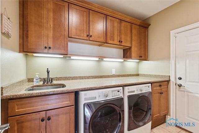 440 W 3rd St, Perrysburg, OH 43551 - washroom featuring washing machine and dryer, cabinet space, and light tile patterned flooring
