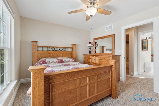 440 W 3rd St, Perrysburg, OH 43551 - bedroom with light carpet, multiple windows, and ceiling fan