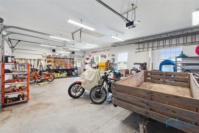 440 W 3rd St, Perrysburg, OH 43551 - garage with a workshop area and a garage door opener