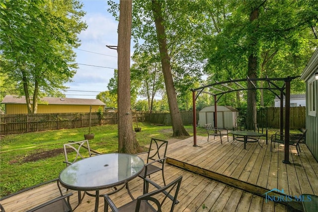 4252 Foxchapel Rd, Toledo, OH 43607 - wooden deck with a storage unit, a fenced backyard, and outdoor dining area