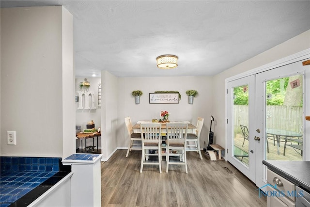 4252 Foxchapel Rd, Toledo, OH 43607 - dining space featuring french doors and wood finished floors