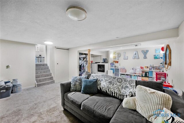 4252 Foxchapel Rd, Toledo, OH 43607 - carpeted living area featuring a textured ceiling and stairs