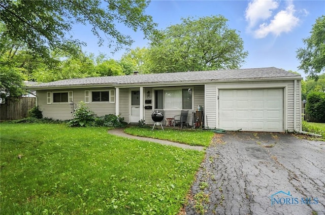 3636 Prairie Ave, Toledo, OH 43614 - ranch-style house featuring an attached garage, driveway, and a porch