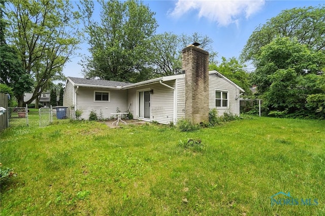 3636 Prairie Ave, Toledo, OH 43614 - rear view of property featuring a chimney