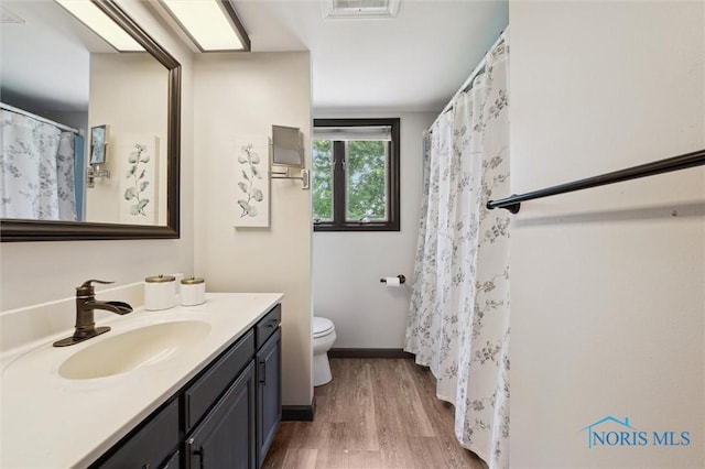 17715 Mitchell Rd, Bowling Green, OH 43402 - full bath featuring vanity, wood finished floors, and a shower with curtain