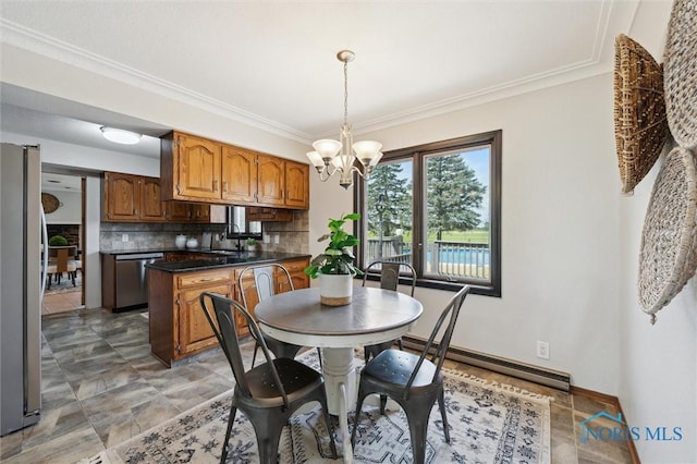 17715 Mitchell Rd, Bowling Green, OH 43402 - dining space featuring a chandelier, a baseboard radiator, and crown molding