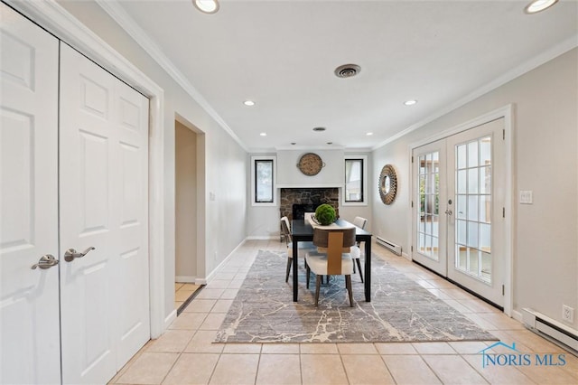 17715 Mitchell Rd, Bowling Green, OH 43402 - dining room with french doors, crown molding, baseboard heating, light tile patterned floors, and recessed lighting