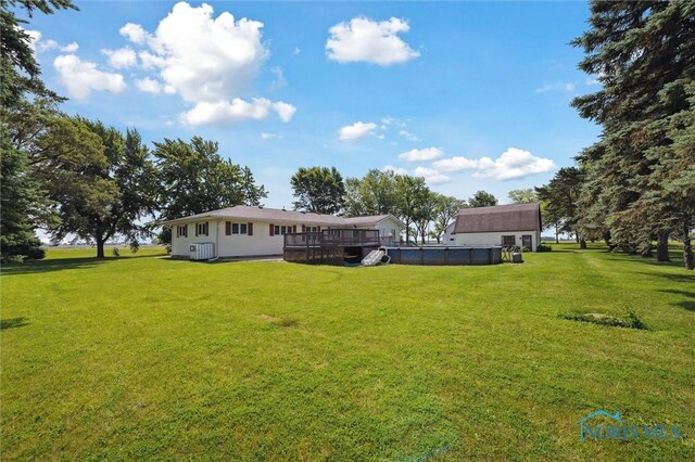 17715 Mitchell Rd, Bowling Green, OH 43402 - view of green lawn with a deck