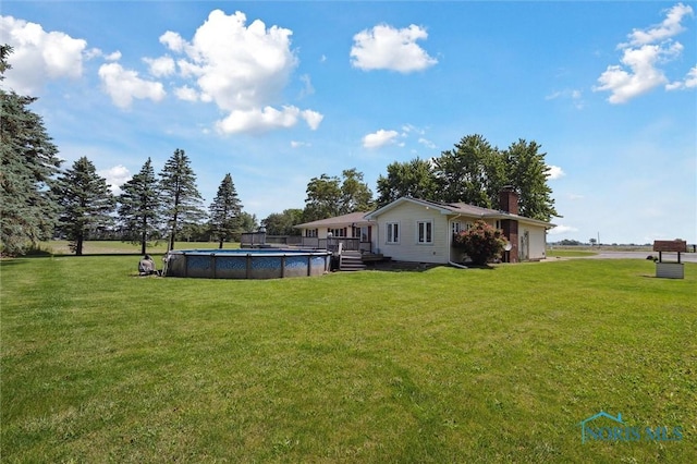 17715 Mitchell Rd, Bowling Green, OH 43402 - view of green lawn with a covered pool