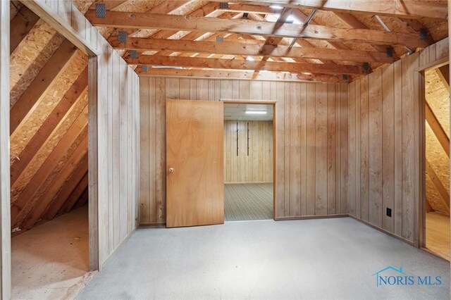 17715 Mitchell Rd, Bowling Green, OH 43402 - unfurnished room with vaulted ceiling and wood walls