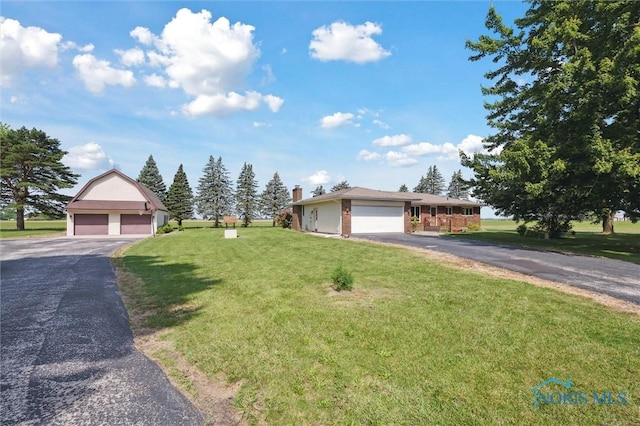 17715 Mitchell Rd, Bowling Green, OH 43402 - single story home featuring a front lawn, a garage, and a chimney