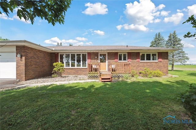 17715 Mitchell Rd, Bowling Green, OH 43402 - ranch-style home featuring brick siding, an attached garage, and a front lawn