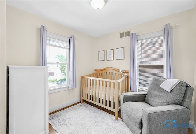 3743 Woodmont Rd, Toledo, OH 43613 - bedroom featuring wood finished floors and baseboards
