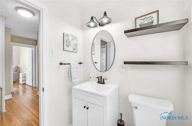 3743 Woodmont Rd, Toledo, OH 43613 - half bathroom with vanity and wood finished floors