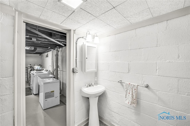 3743 Woodmont Rd, Toledo, OH 43613 - bathroom featuring independent washer and dryer and a sink